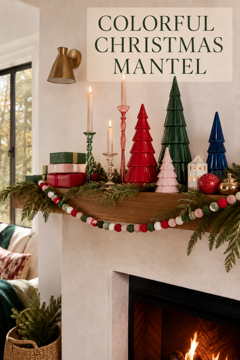 Colorful ceramic Christmas trees, glass candlesticks, gifts, and evergreen mantel.