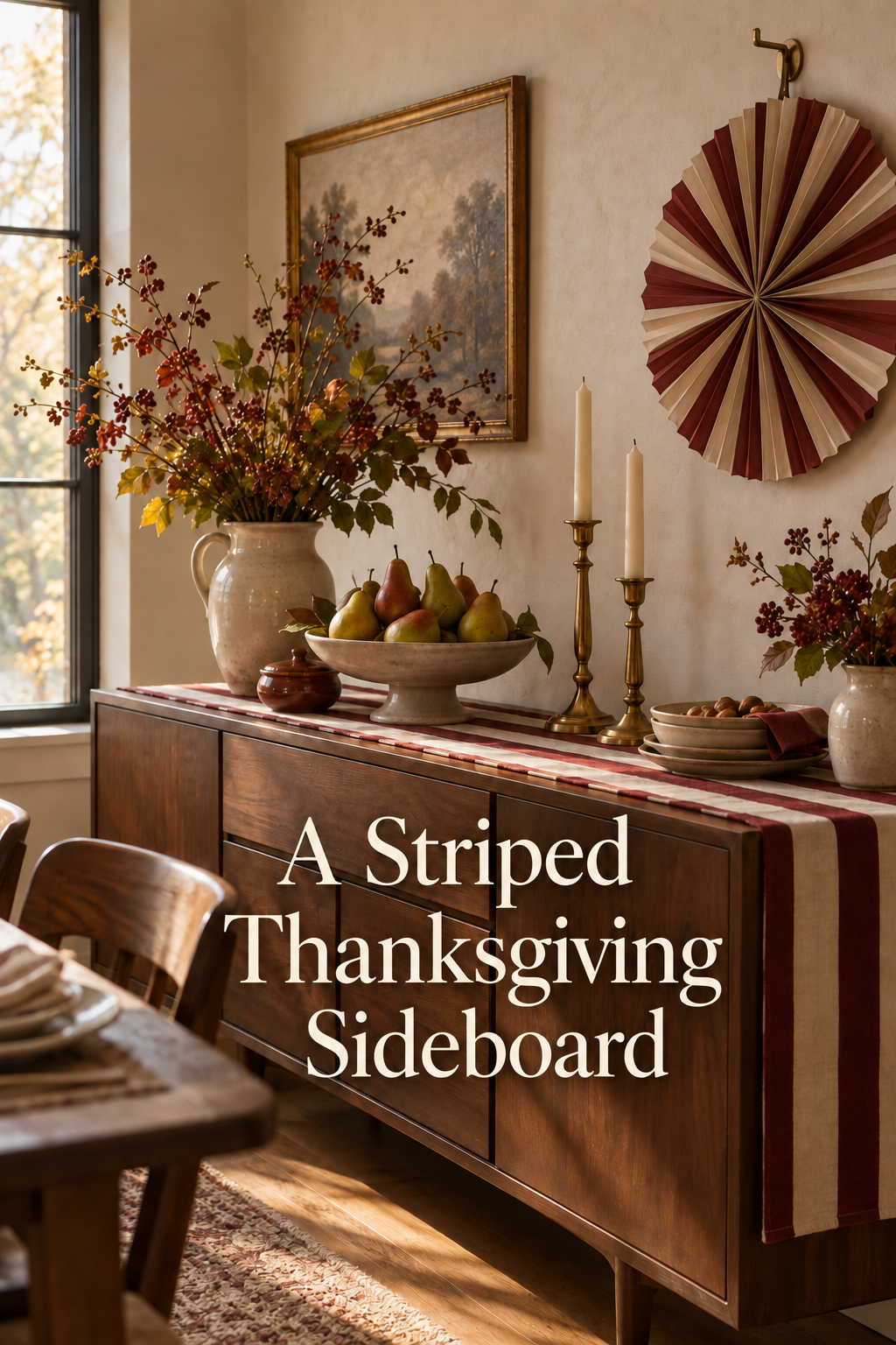 Striped Thanksgiving sideboard with pears, autumn branches and brass candleholders.